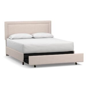 Platform bed with upholstered footboard and storage drawer
